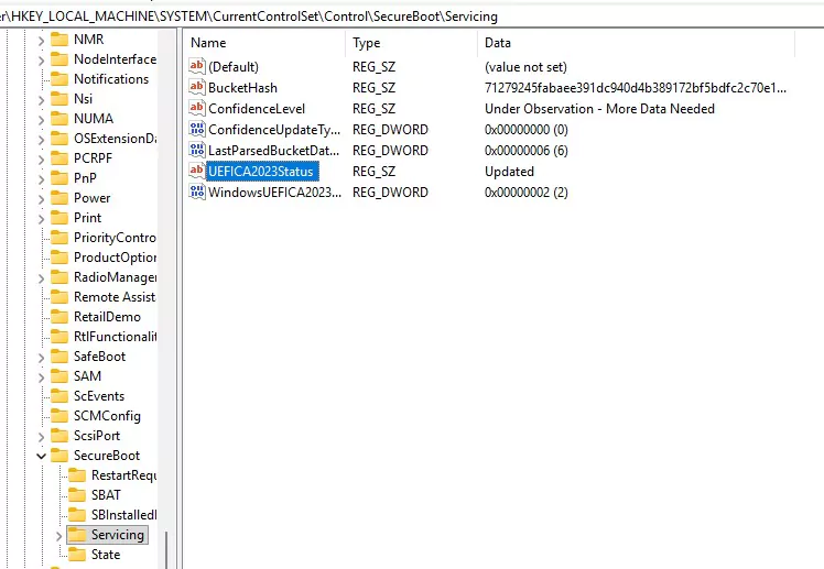Registry Editor showing HKLM\SYSTEM\CurrentControlSet\Control\SecureBoot\Servicing with UEFICA2023Status set to Updated and WindowsUEFICA2023Capable set to 2