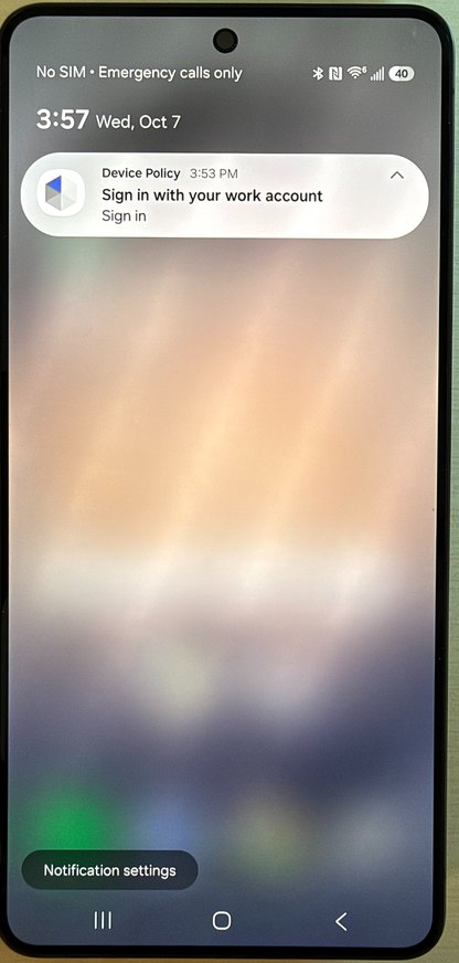 Android lock screen showing a Device Policy notification that reads Sign in with your work account, with a Sign in action